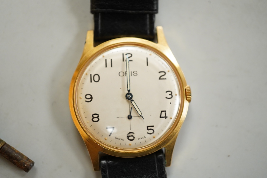 A George V silver cased goliath calendar moon phase open faced pocket watch, case diameter approx. 67mm(a.f.), together with five other pocket watches, including silver and white metal Waltham, a Camerer Cuss chrome case